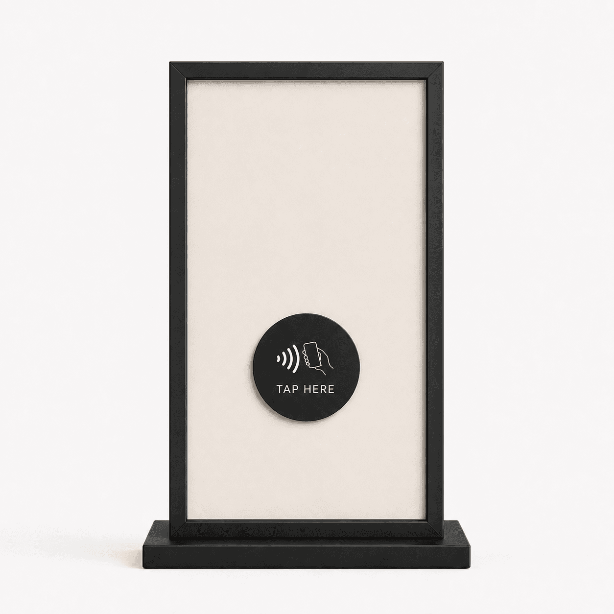 The Suji table card: a matte black frame around a warm edge-lit panel on a small weighted base, with an NFC tap disc reading TAP HERE.